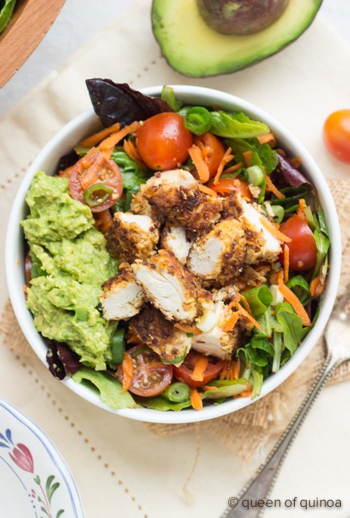 A simple salad topped with crispy #quinoa chicken - perfect for game day!