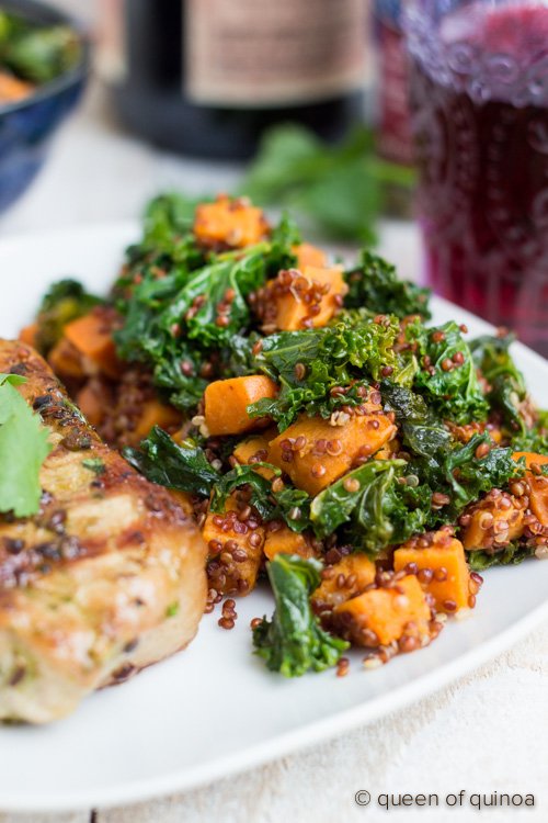 A simple grilled pork chop recipe served with a warm sweet potato, kale and red quinoa salad.
